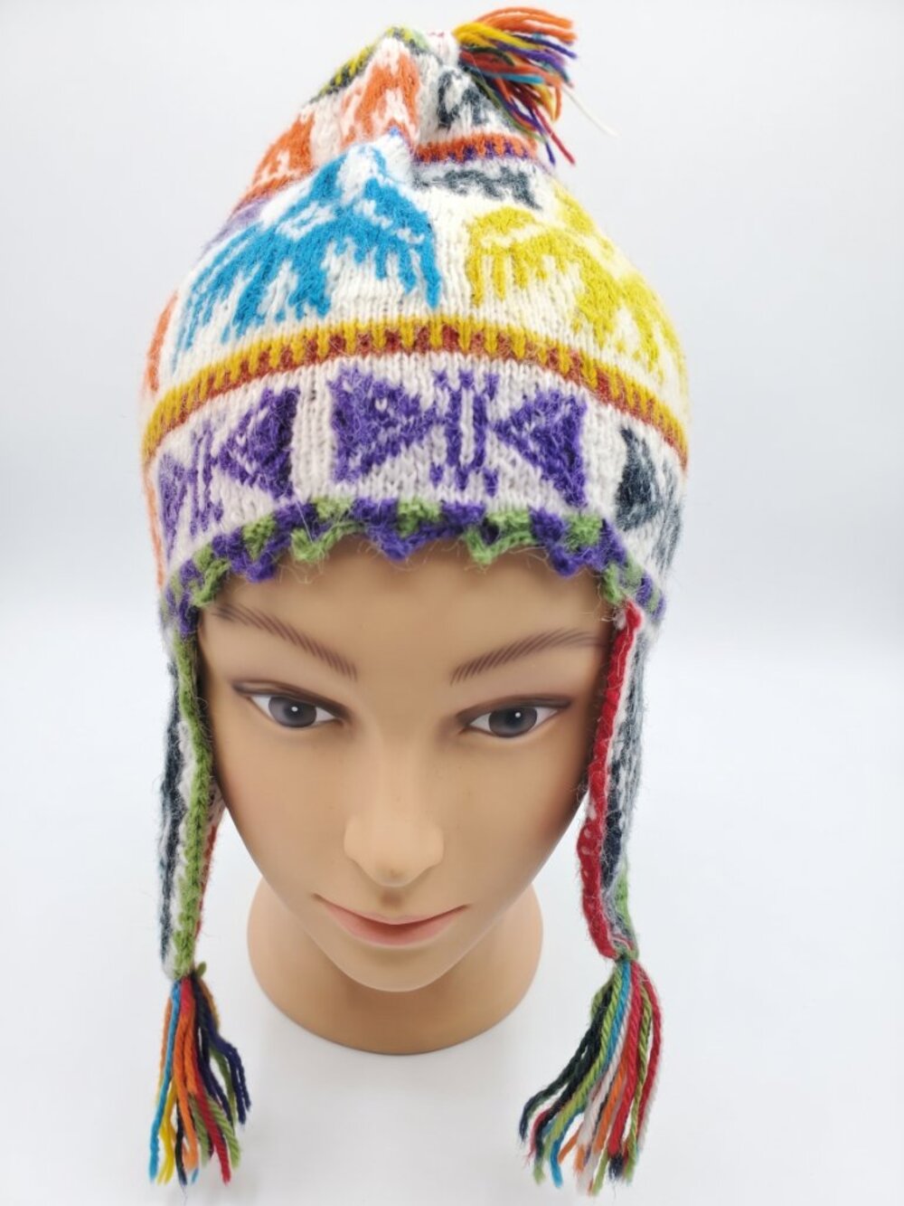 Hand-knitted sheep's wool chullo with condor and geometric designs.